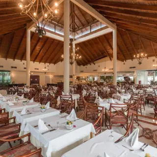 Poseidon restaurant with high vaulted wood ceilings at Grand Palladium Punta Cana
