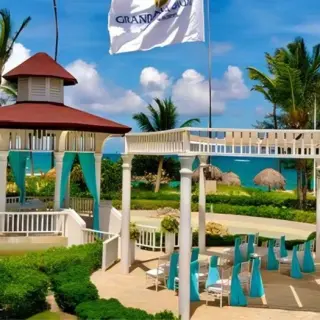 Sea view gazebo wedding ceremony venue with turquoise drapes at Grand Palladium, Punta Cana