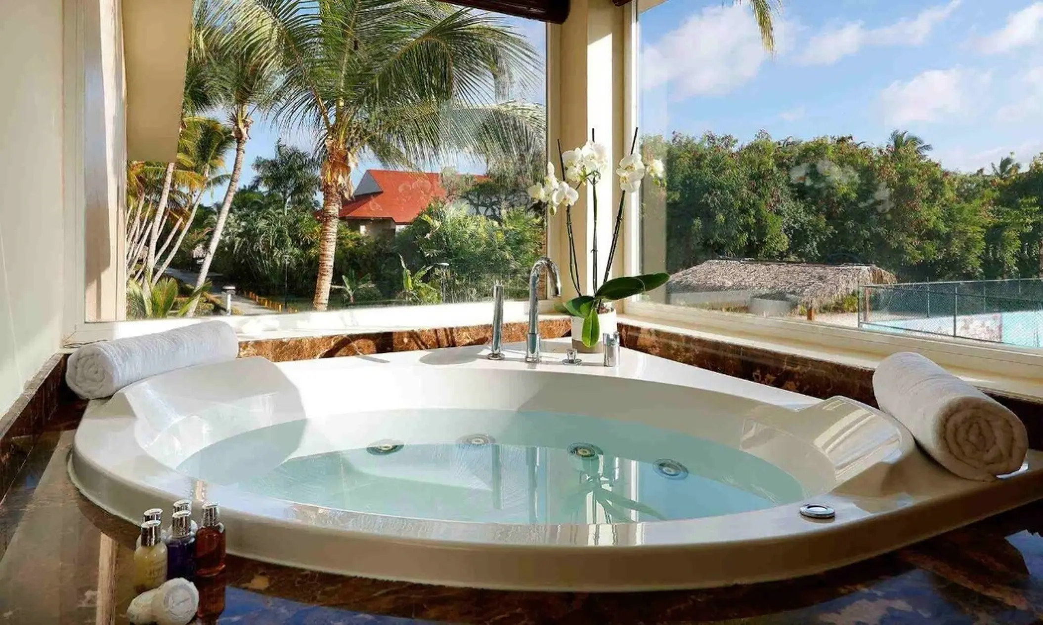 Indoor jetted soaking tub with large windows at Grand Palladium Punta Cana, Punta Cana