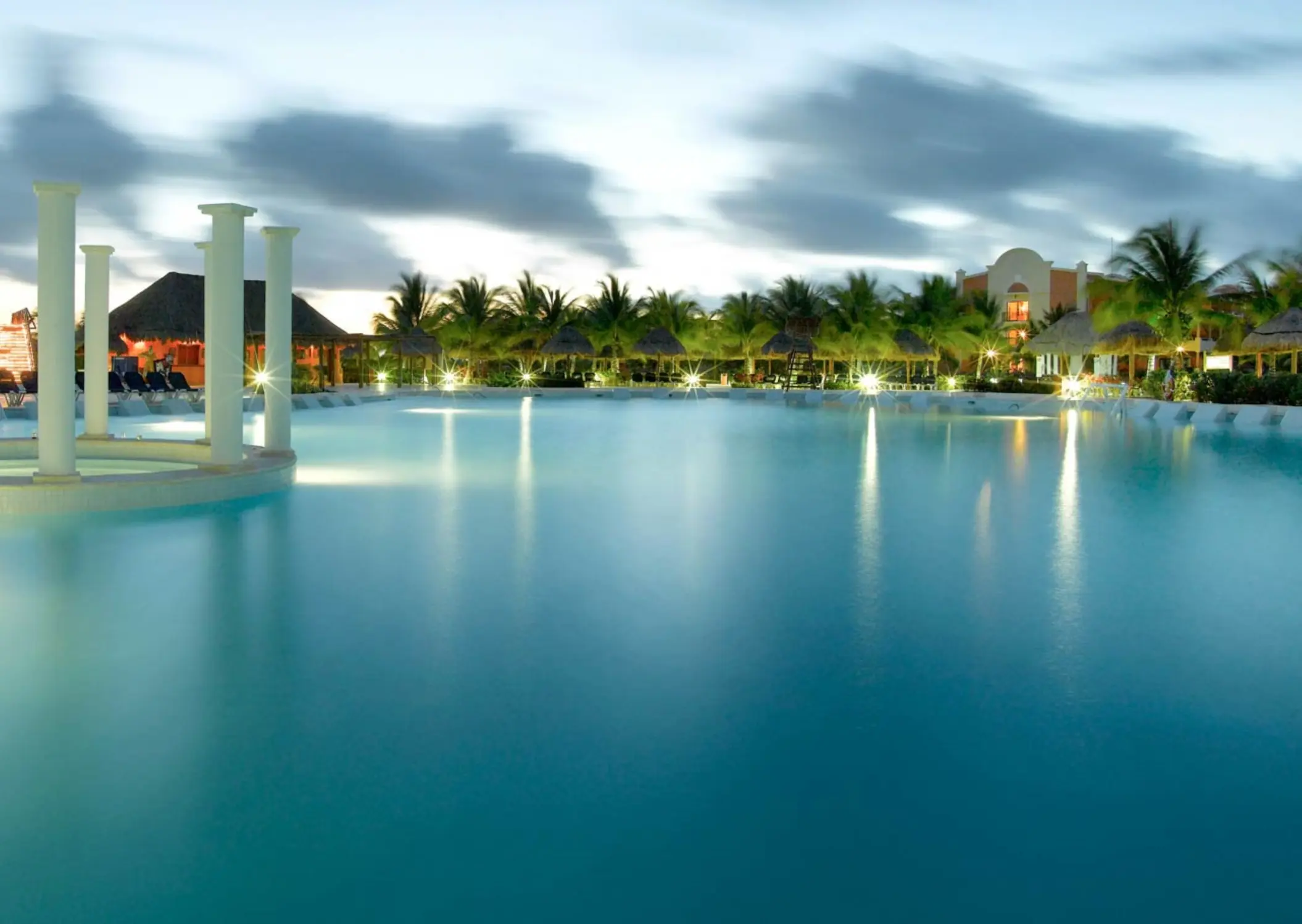Grand Palladium Kantenah swimming pool and columns at dusk, Riviera Maya