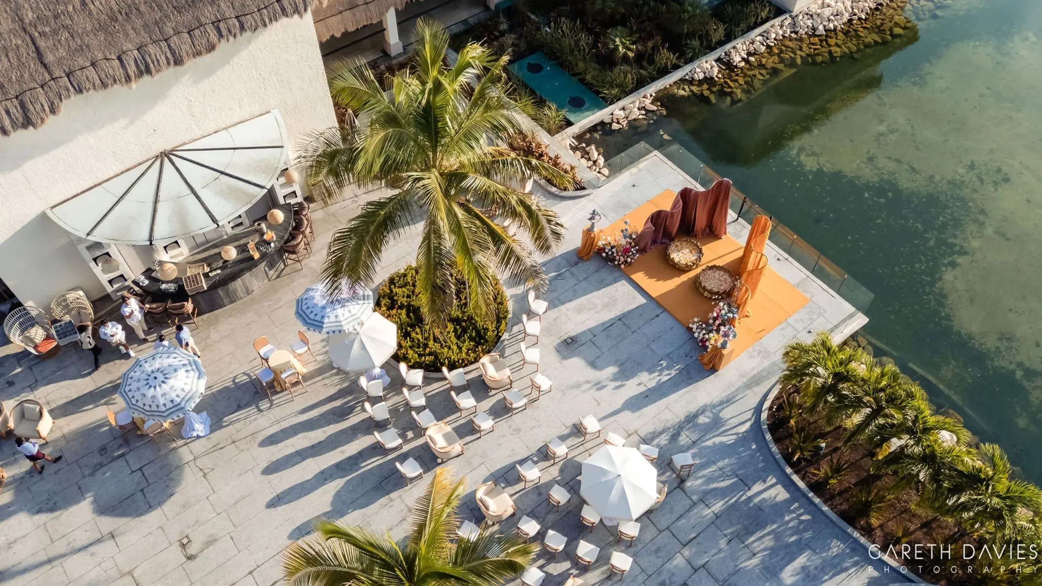 Aerial view of a South Asian Haldi ceremony setup on a terrace at Grand Palladium, Riviera Maya