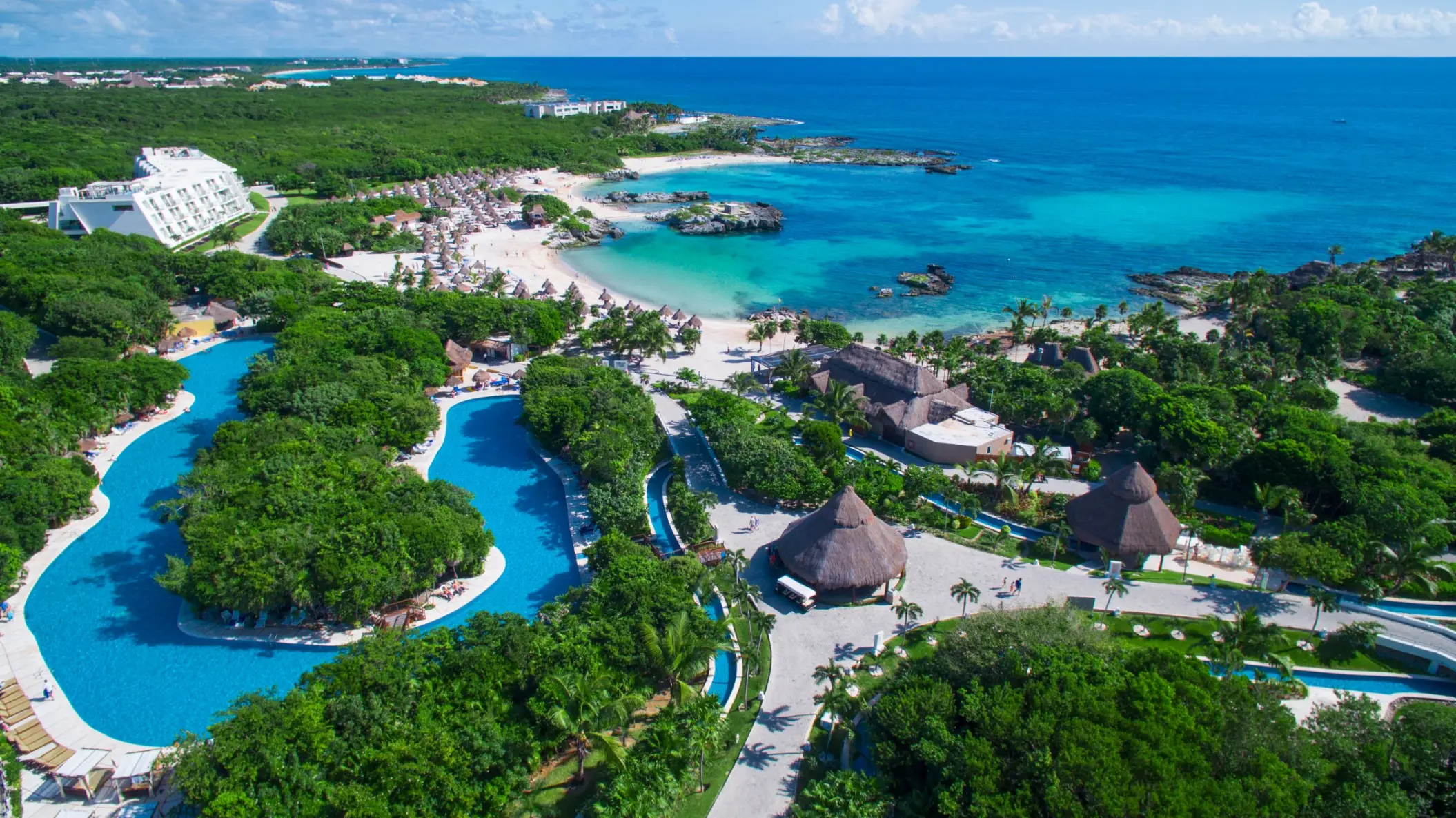 aerial view of Grand Sirenis Riviera Maya with its beach and lazy river and accommodations