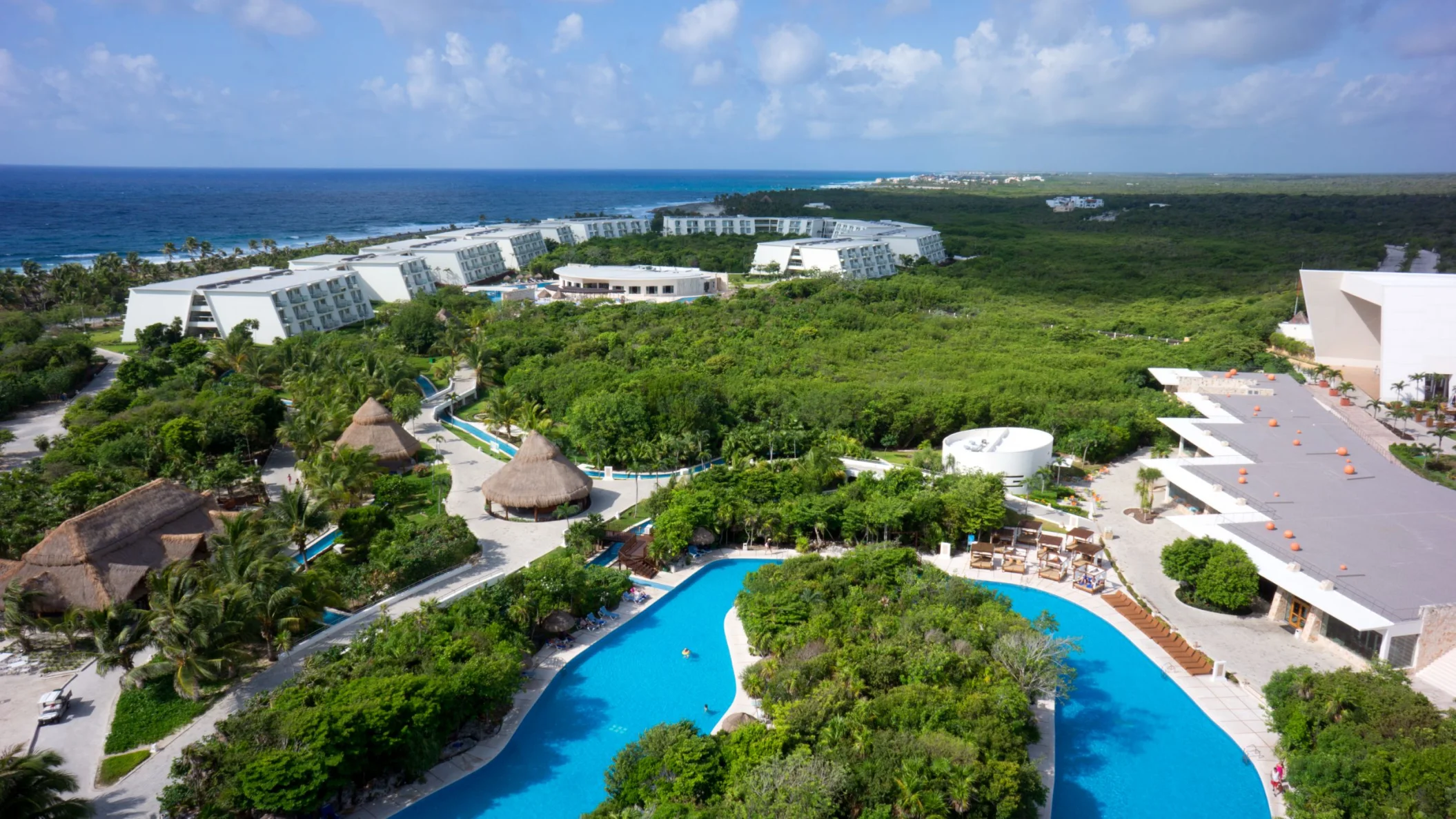 aerial view of the lazy river and resort buildings at Grand Sirenis Riviera Maya