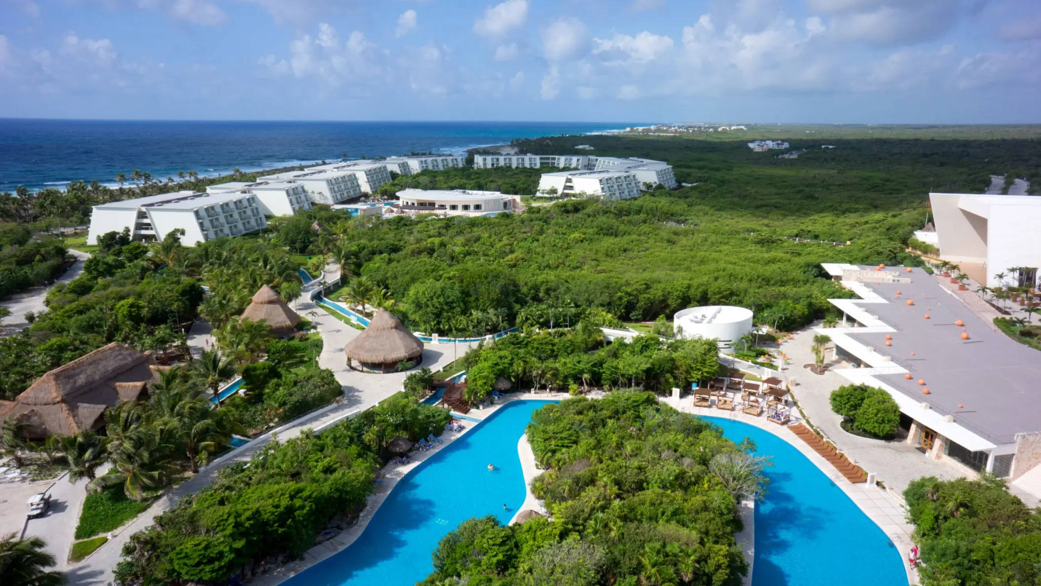 aerial view of the lazy river and resort buildings at Grand Sirenis Riviera Maya