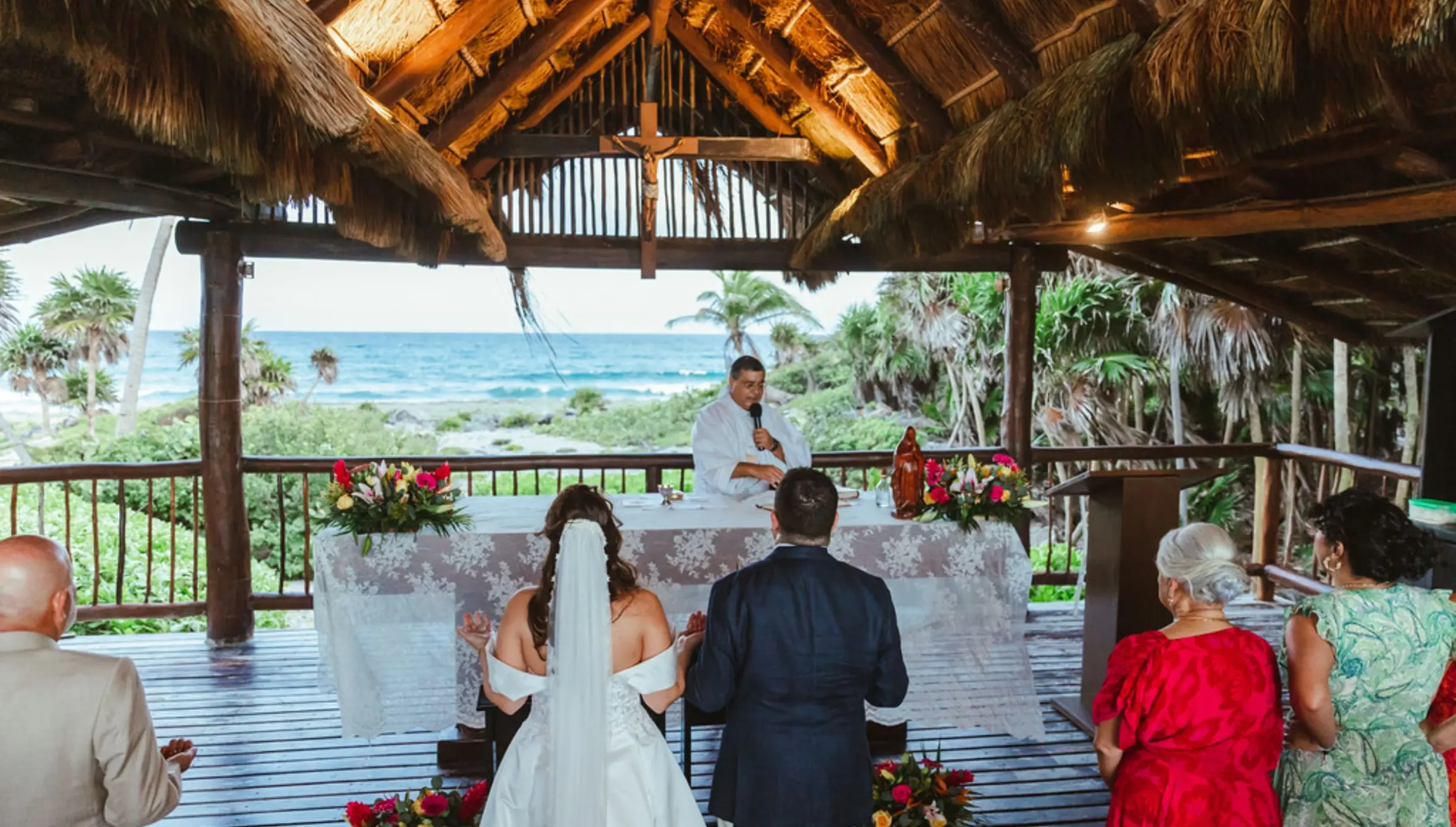 bride and groom and priest and guests at the chapel venue at Grand Sirenis Riviera Maya