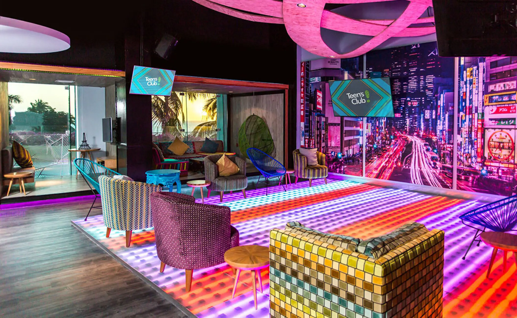 Teens Club lounge with neon lighting and colorful seating at Grand Velas Riviera Nayarit, Puerto Vallarta