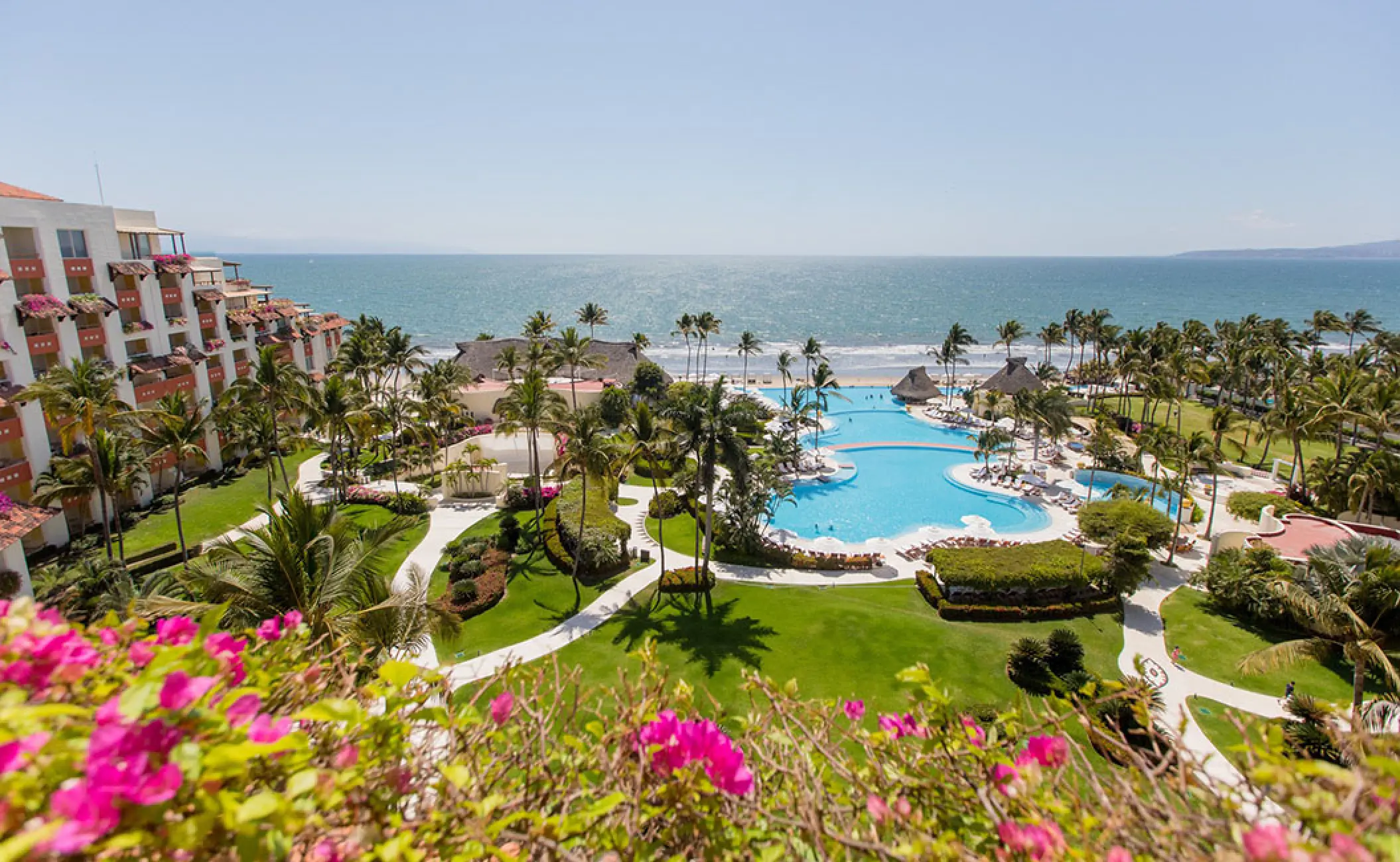 Overview of Grand Velas Riviera Nayarit beachfront pool and lush tropical gardens, Puerto Vallarta