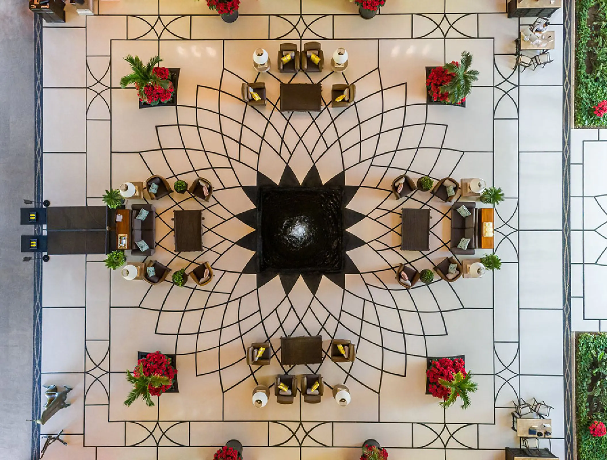 Overhead view of the geometric tiled lobby floor and seating at Grand Velas Riviera Nayarit, Puerto Vallarta