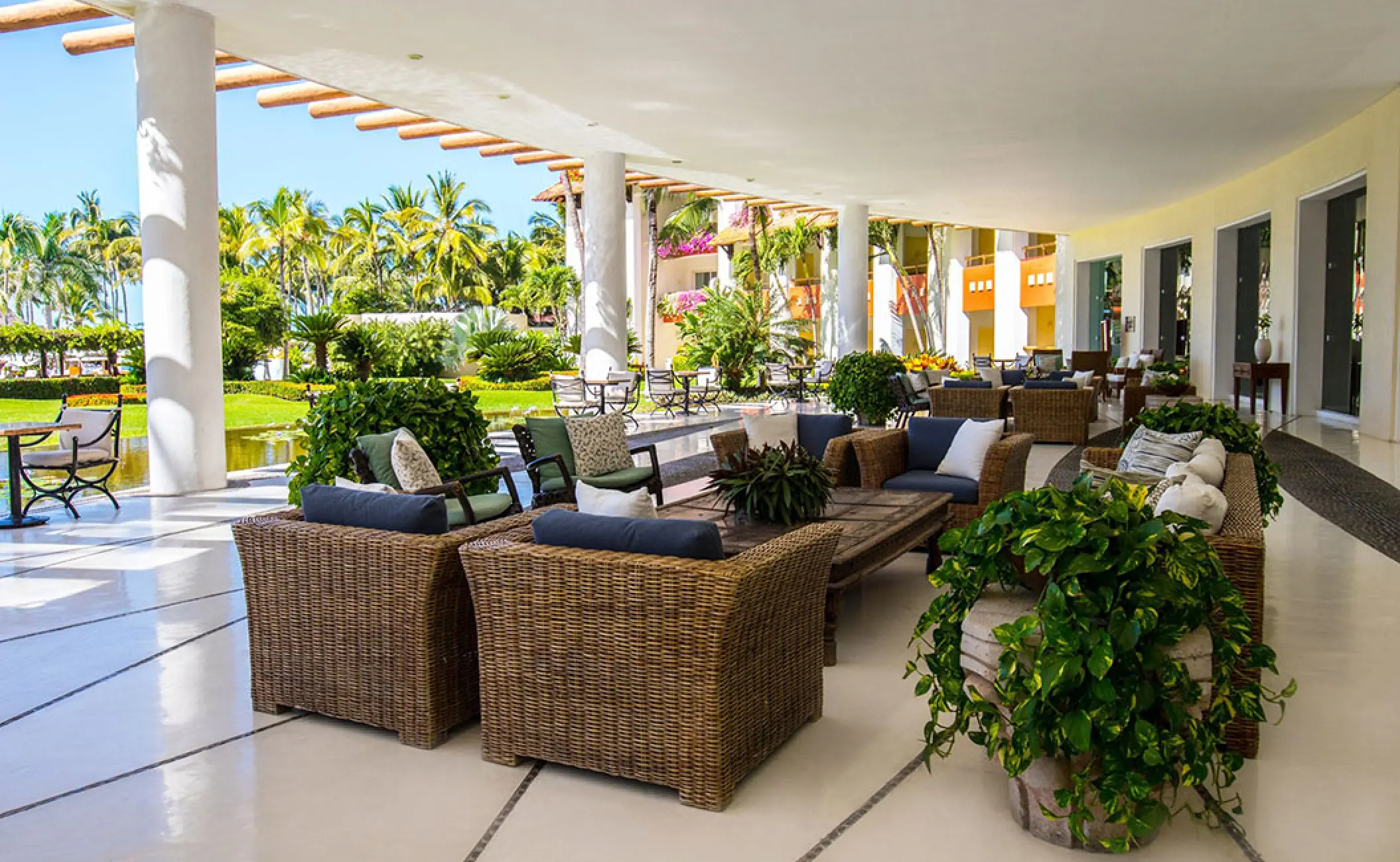 Open-air lobby terrace with wicker seating at Grand Velas Riviera Nayarit, Puerto Vallarta