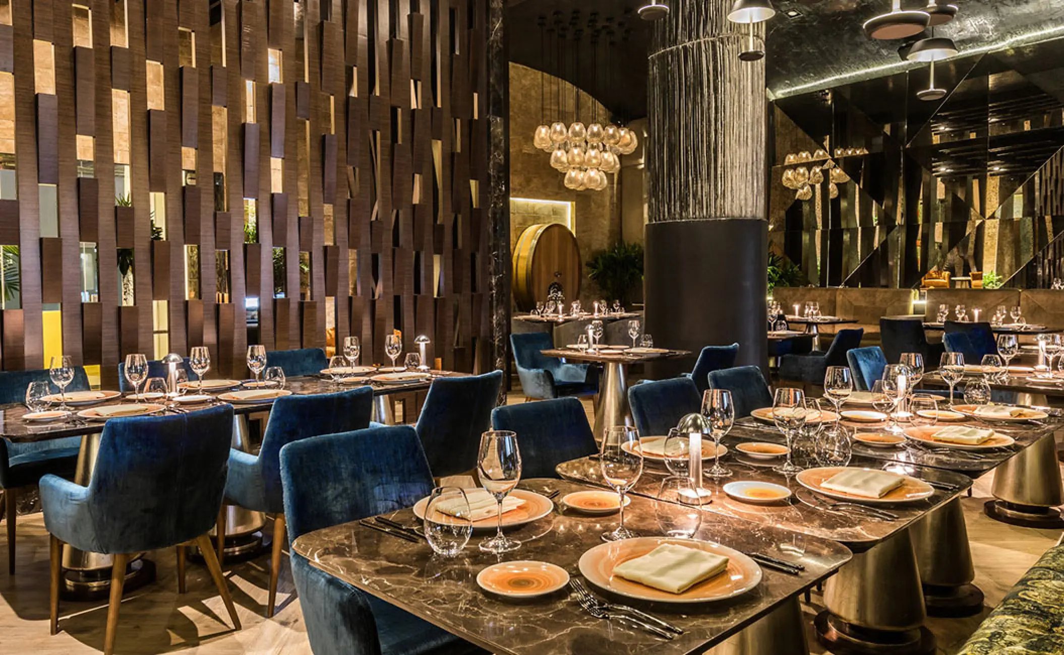 Lucca restaurant dining tables and blue velvet chairs at Grand Velas Riviera Nayarit, Puerto Vallarta