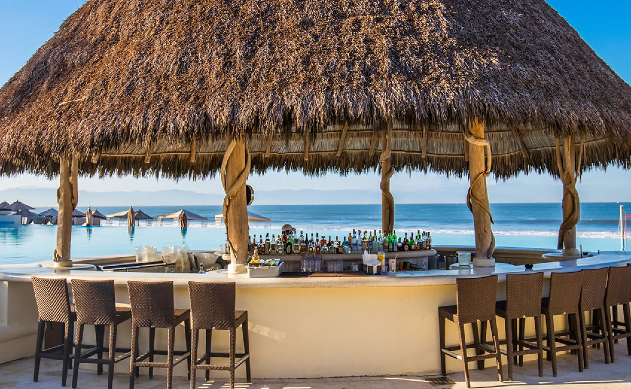 Swim-up pool bar with palapa roof at Grand Velas Riviera Nayarit, Puerto Vallarta