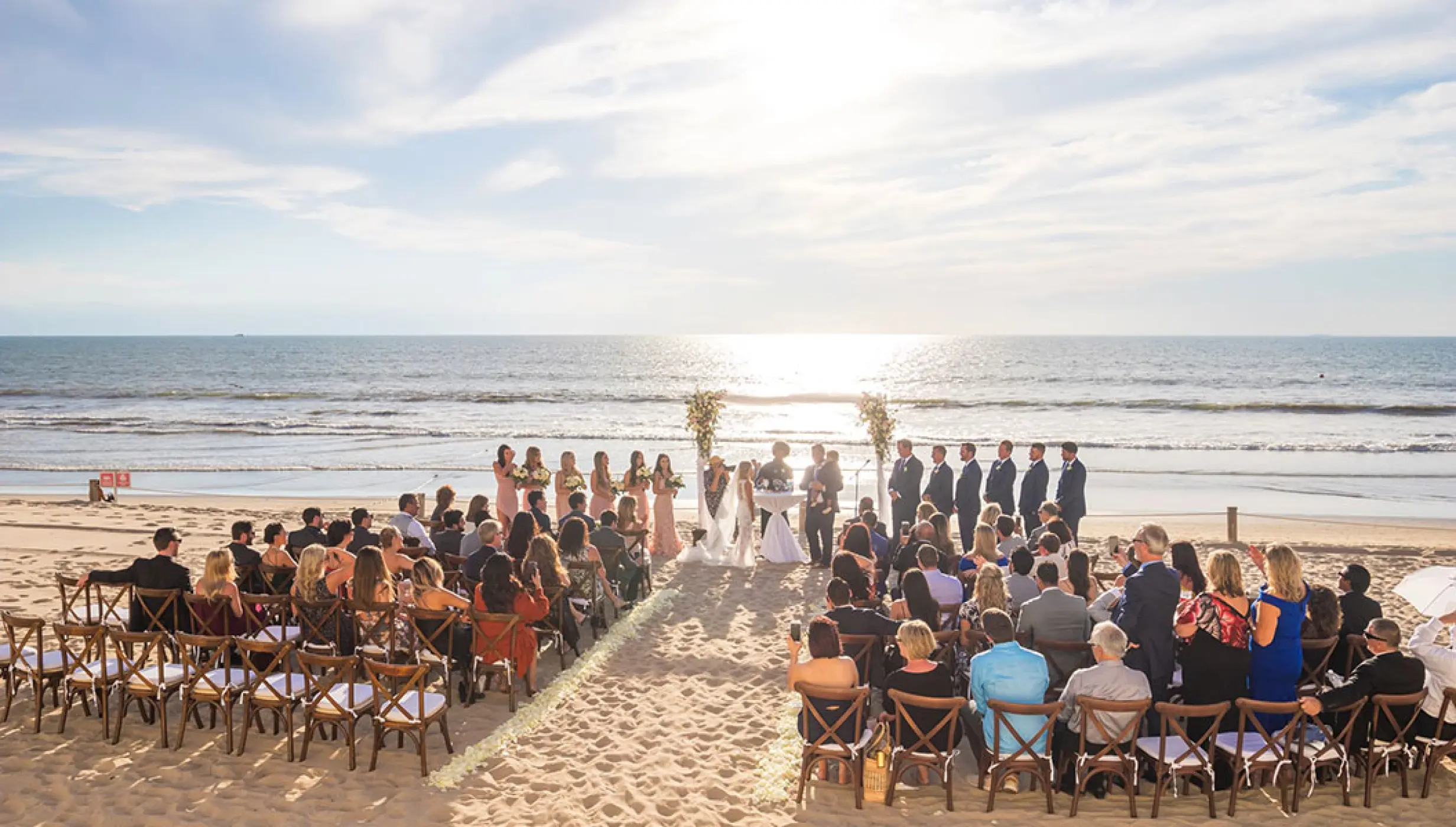 Beachfront wedding ceremony with seated guests at Grand Velas Riviera Nayarit, Puerto Vallarta