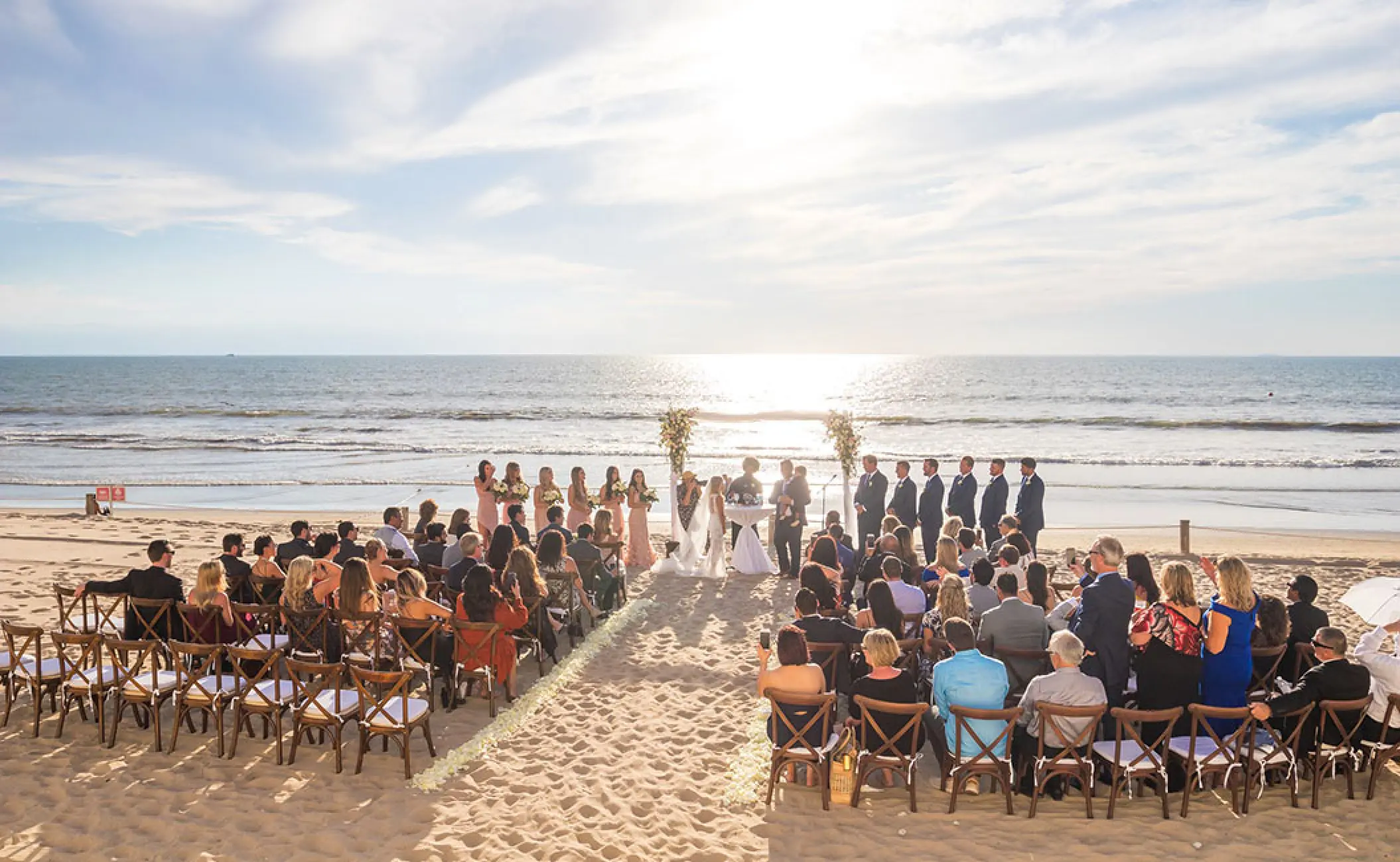 Beachfront wedding ceremony with seated guests at Grand Velas Riviera Nayarit, Puerto Vallarta