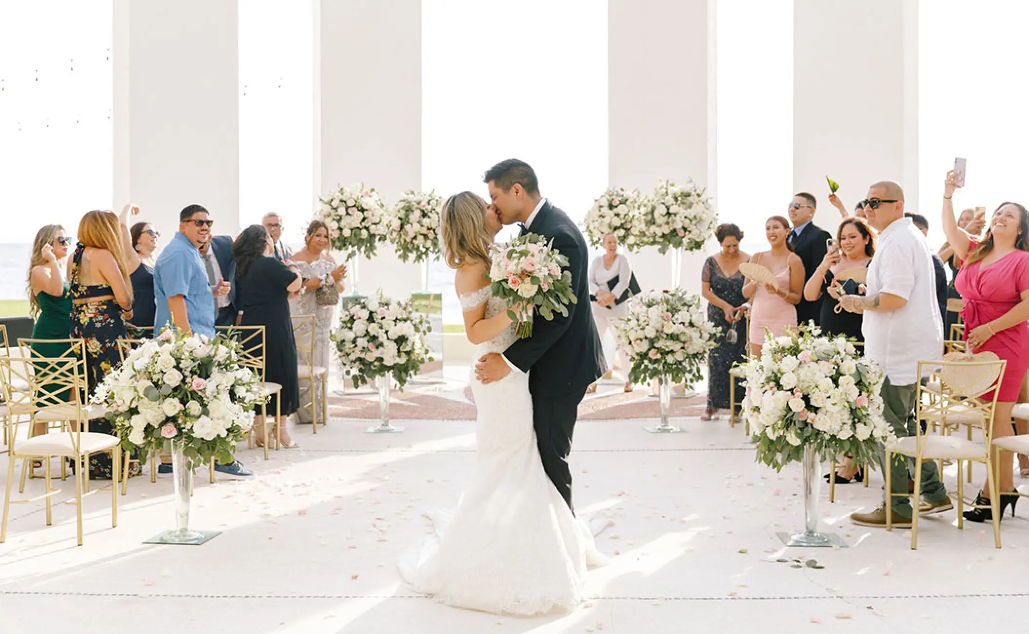 The couple kissing at their wedding ceremony at Grand Velas Riviera Nayarit, Puerto Vallarta