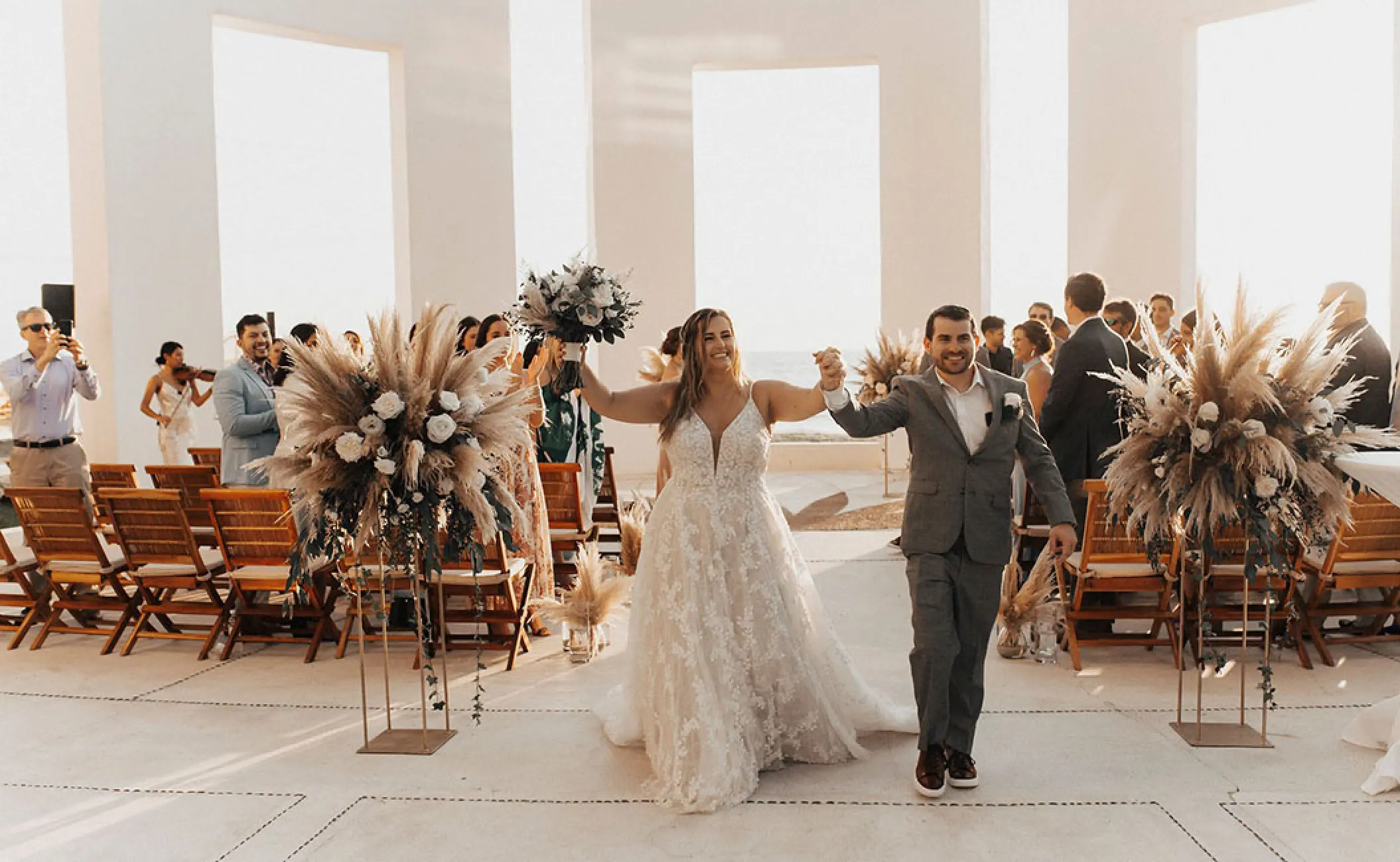 The bride and groom walking down the aisle at Grand Velas Riviera Nayarit, Puerto Vallarta