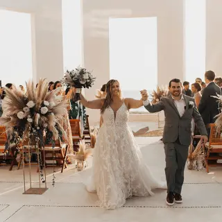 The bride and groom walking down the aisle at Grand Velas Riviera Nayarit, Puerto Vallarta