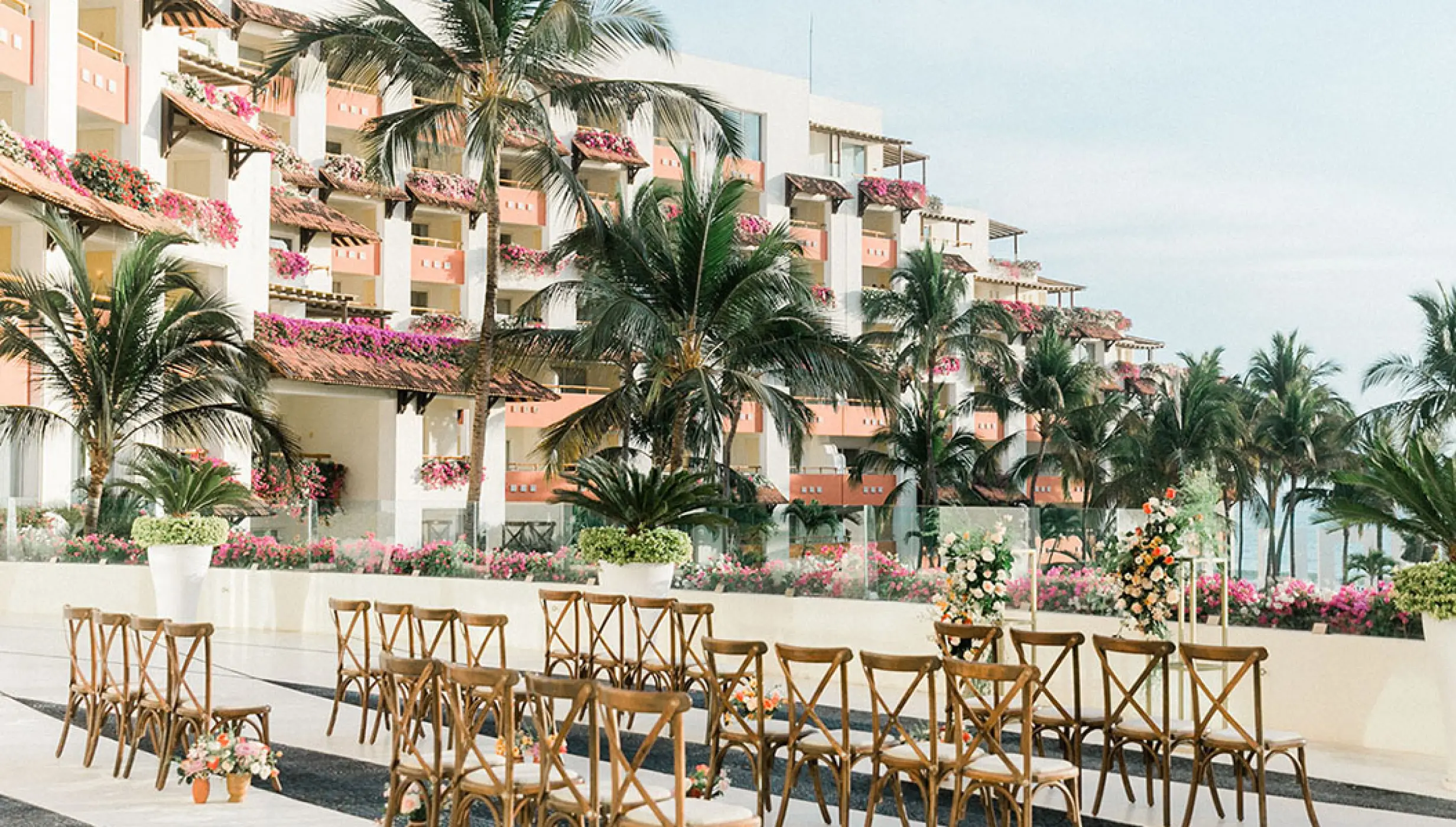 Frida Terrace wedding ceremony setup with wooden chairs at Grand Velas Riviera Nayarit, Puerto Vallarta