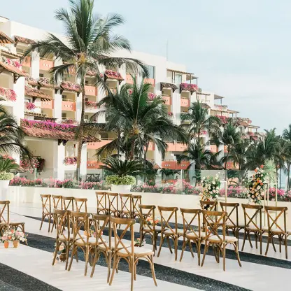 Frida Terrace wedding ceremony setup with wooden chairs at Grand Velas Riviera Nayarit, Puerto Vallarta