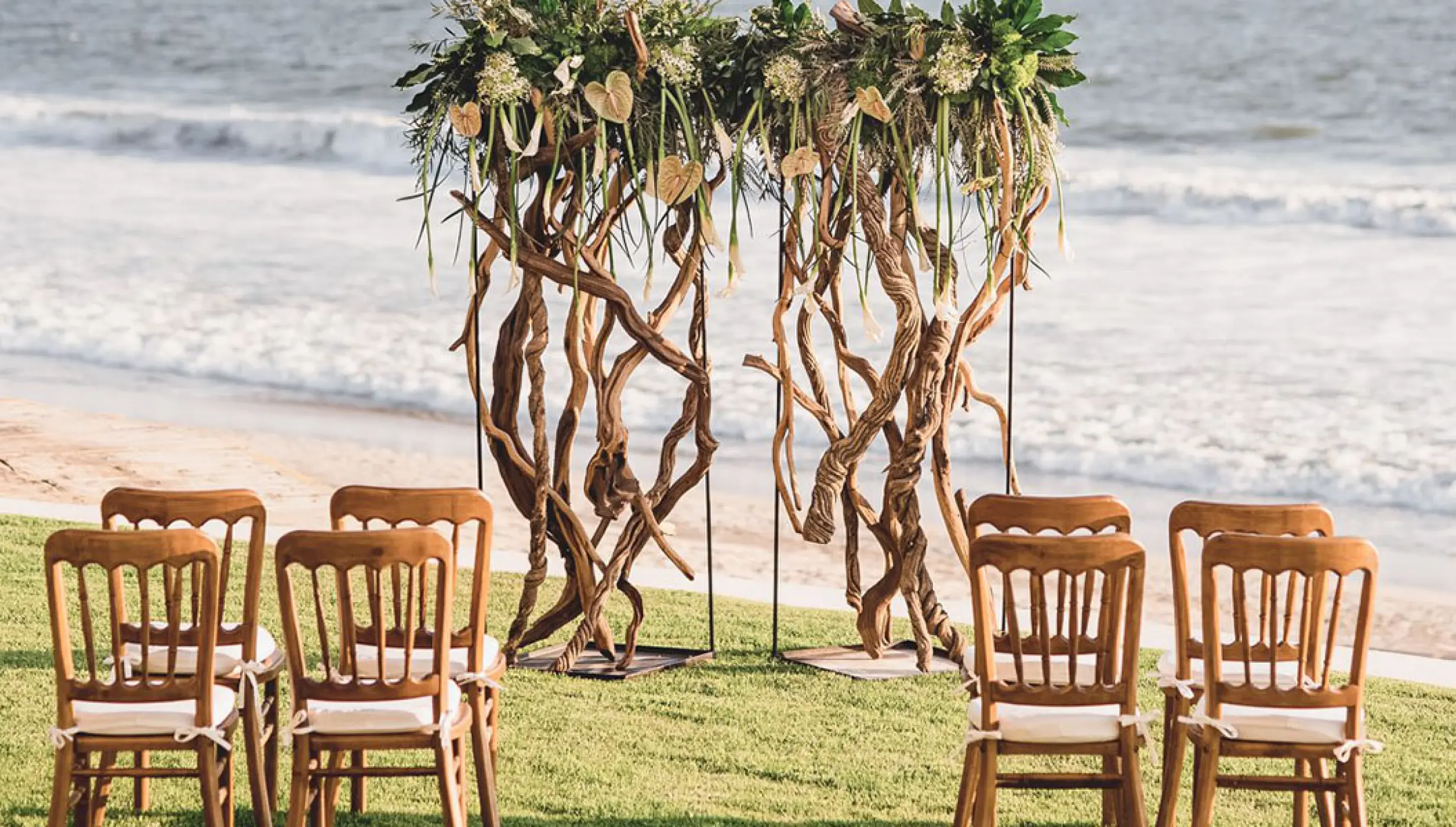 Garden wedding ceremony setup with driftwood arch at Grand Velas Riviera Nayarit, Puerto Vallarta