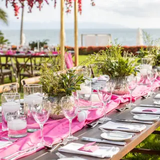 Garden wedding reception setup with pink runners and greenery at Grand Velas Riviera Nayarit, Puerto Vallarta
