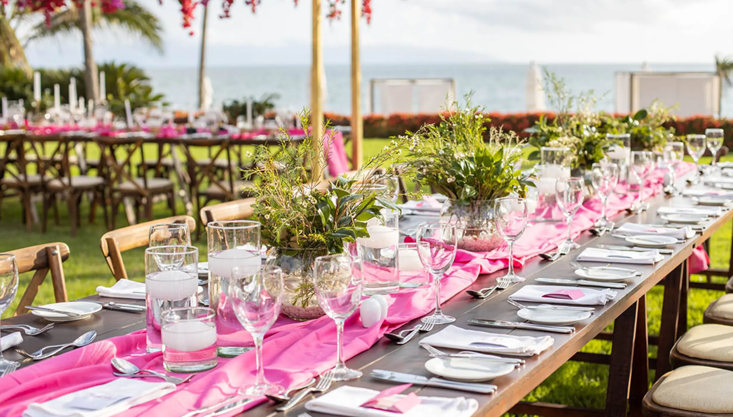 Garden wedding reception setup with pink runners and greenery at Grand Velas Riviera Nayarit, Puerto Vallarta
