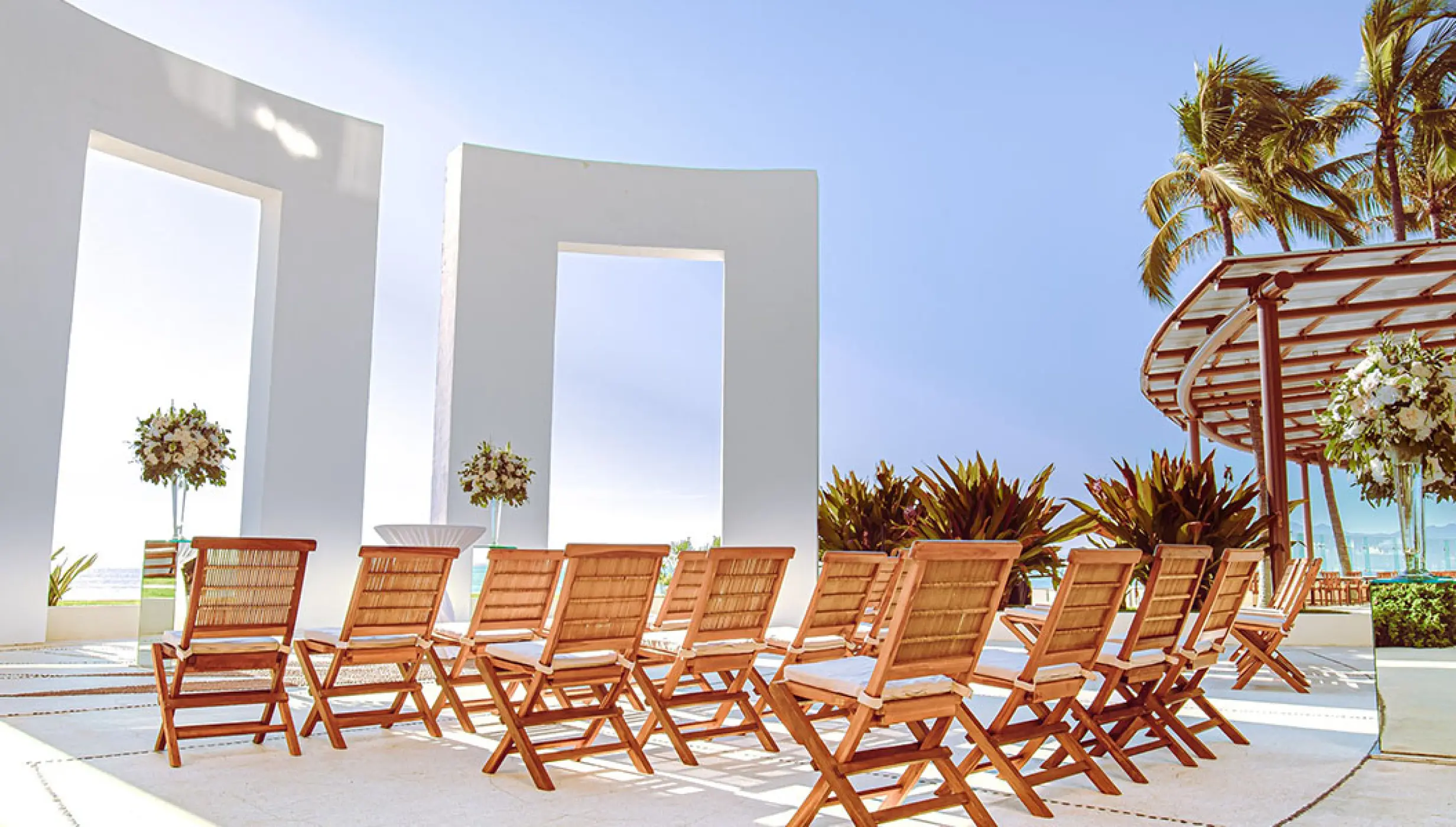 Gazebo terrace wedding ceremony with wooden chairs at Grand Velas Riviera Nayarit, Puerto Vallarta