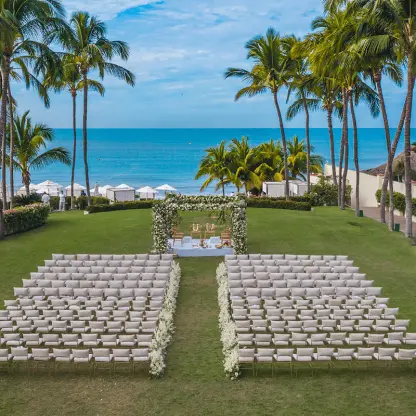 Ocean garden wedding ceremony with white floral arch at Grand Velas Riviera Nayarit, Puerto Vallarta