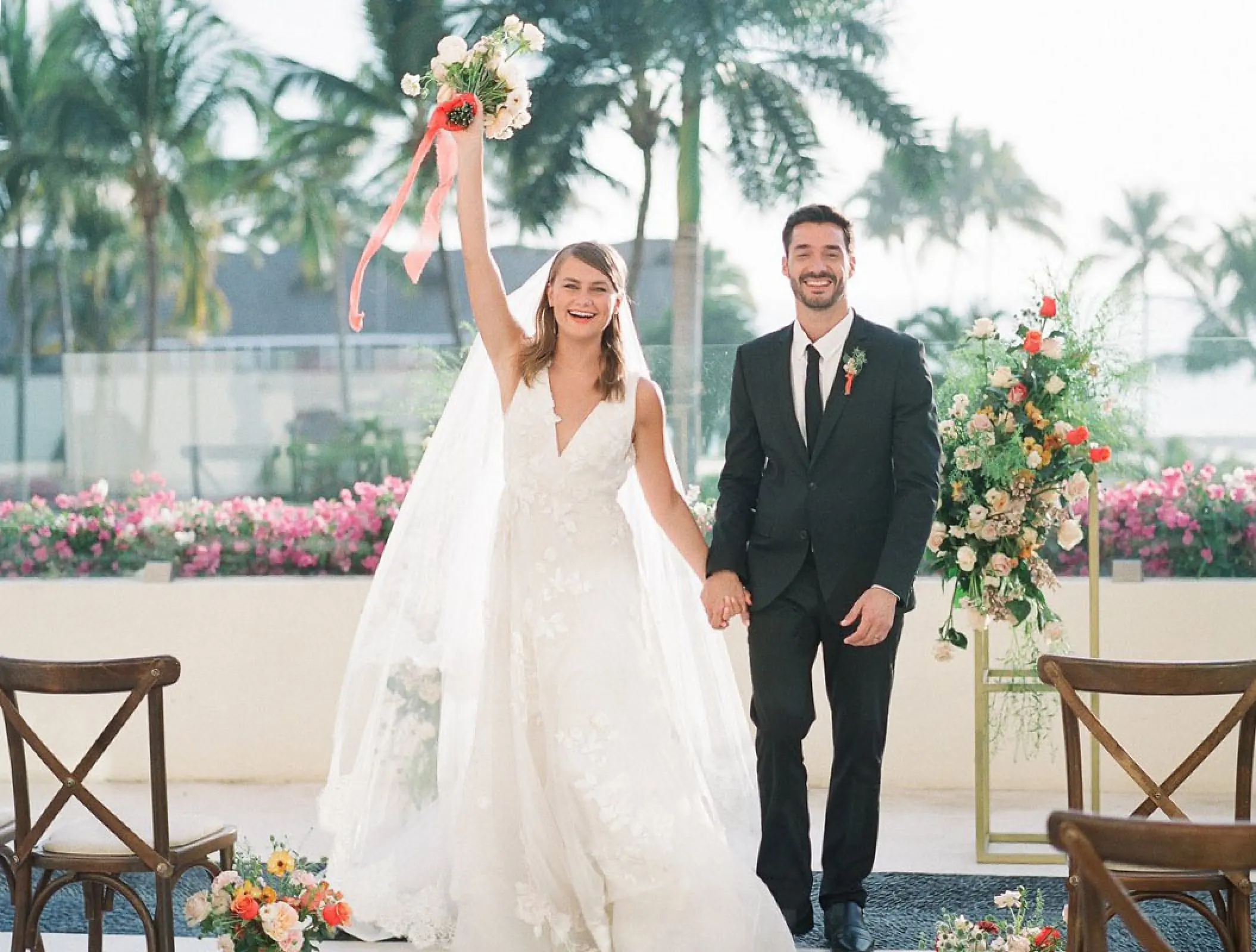 The bride and groom celebrating on the Sky Terrace at Grand Velas Riviera Nayarit, Puerto Vallarta