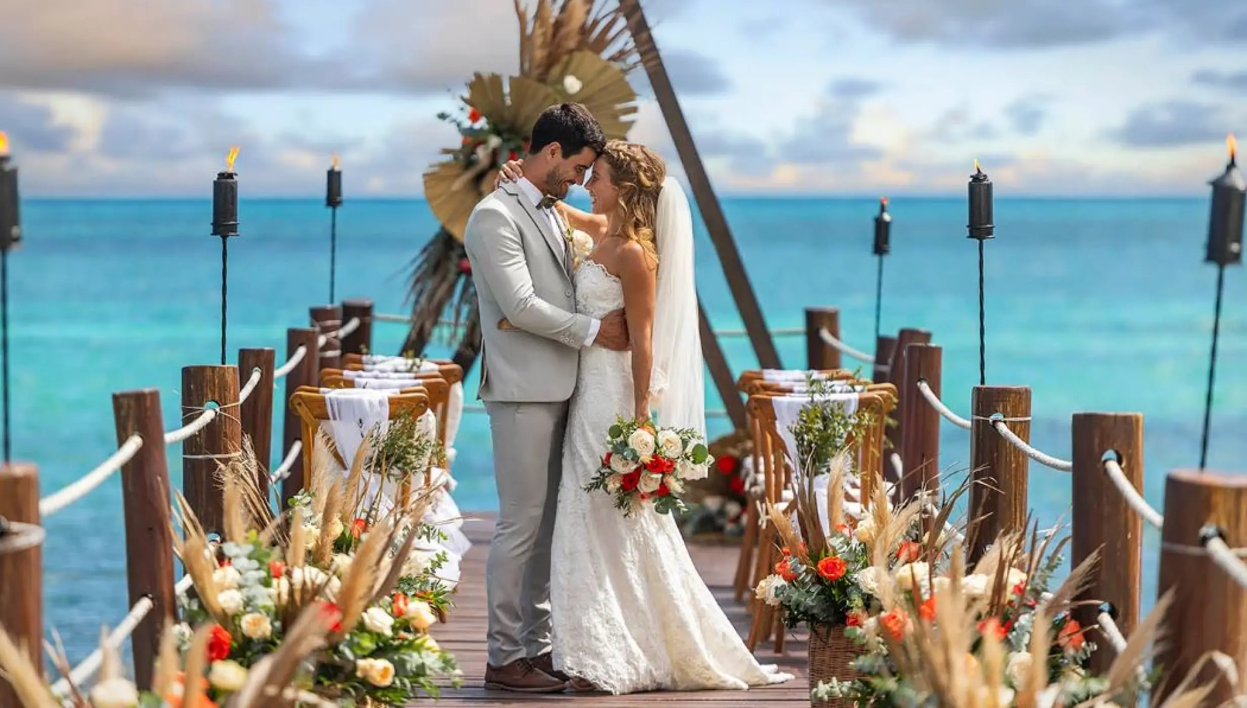 bride and groom on the pier venue at Ocean Maya Royale