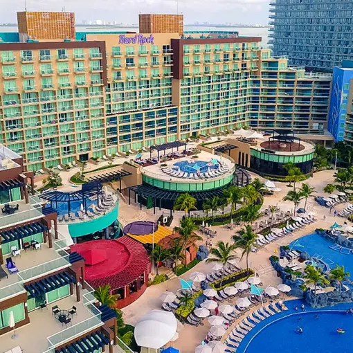 Aerial view of the multi-level pool complex and main building at Hard Rock Cancun