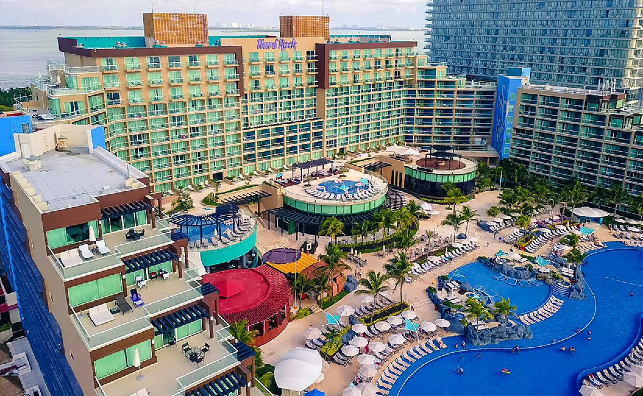 Aerial view of the multi-level pool complex and main building at Hard Rock Cancun