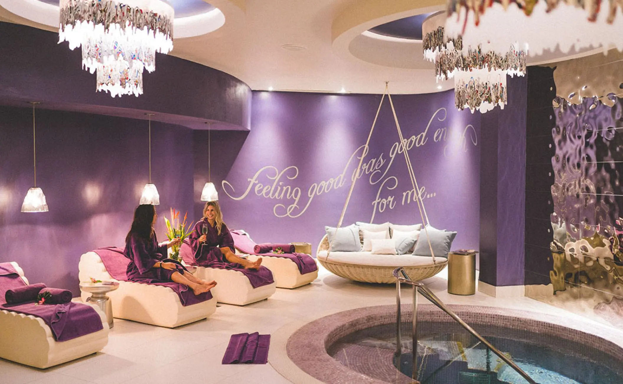 Women relaxing in the Rock Spa lounge by a hydrotherapy pool at Hard Rock Vallarta, Puerto Vallarta