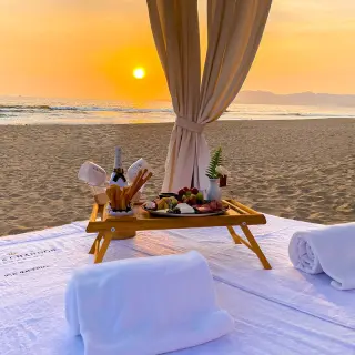 Private beach sunset dinner setup with champagne at Hard Rock Hotel Vallarta, Puerto Vallarta