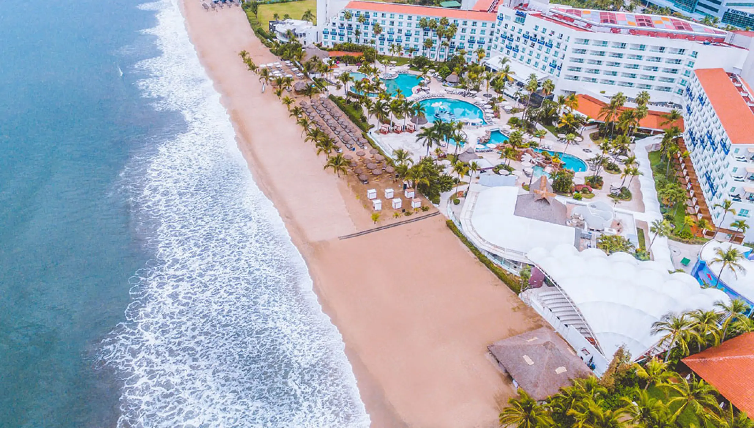 Aerial view of the beach and pool area at Hard Rock Hotel Vallarta, Puerto Vallarta