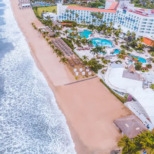 Aerial view of the beach and pool area at Hard Rock Hotel Vallarta, Puerto Vallarta