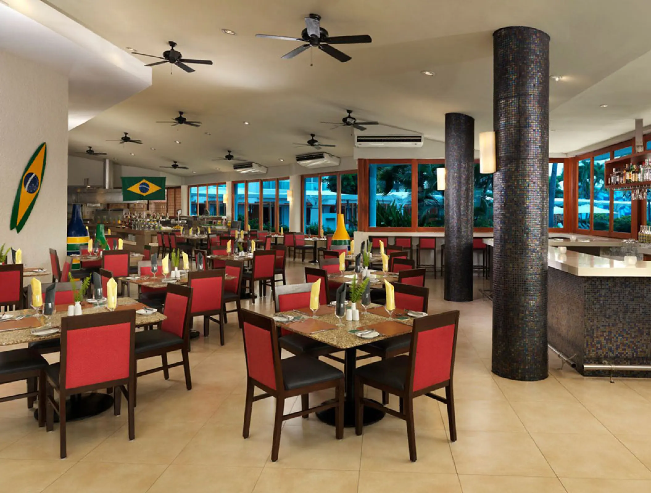 Ipanema restaurant dining room with red chairs and Brazilian decor at Hard Rock Vallarta, Puerto Vallarta