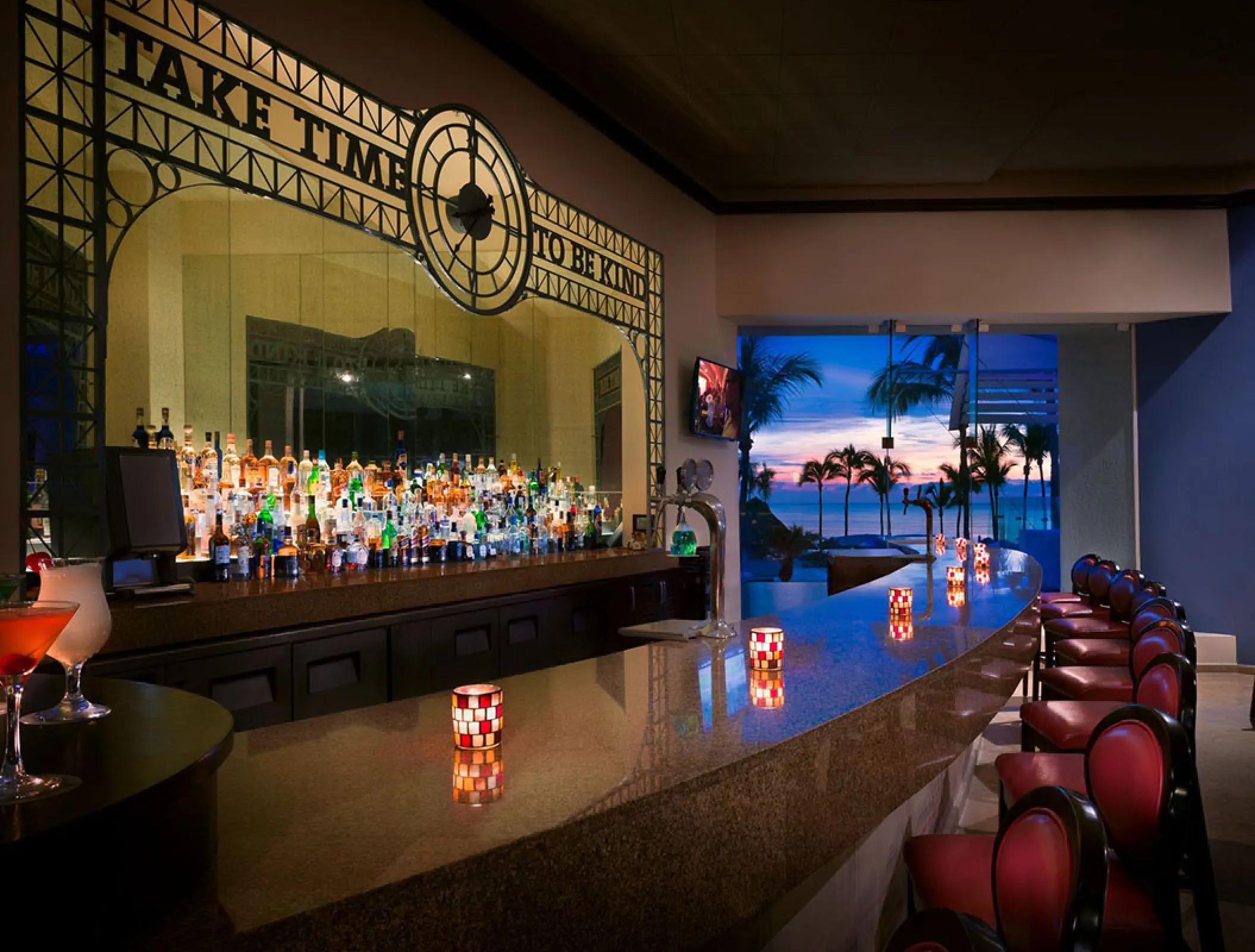 Sun Bar with decorative clock sign and ocean views at Hard Rock Hotel Vallarta, Puerto Vallarta