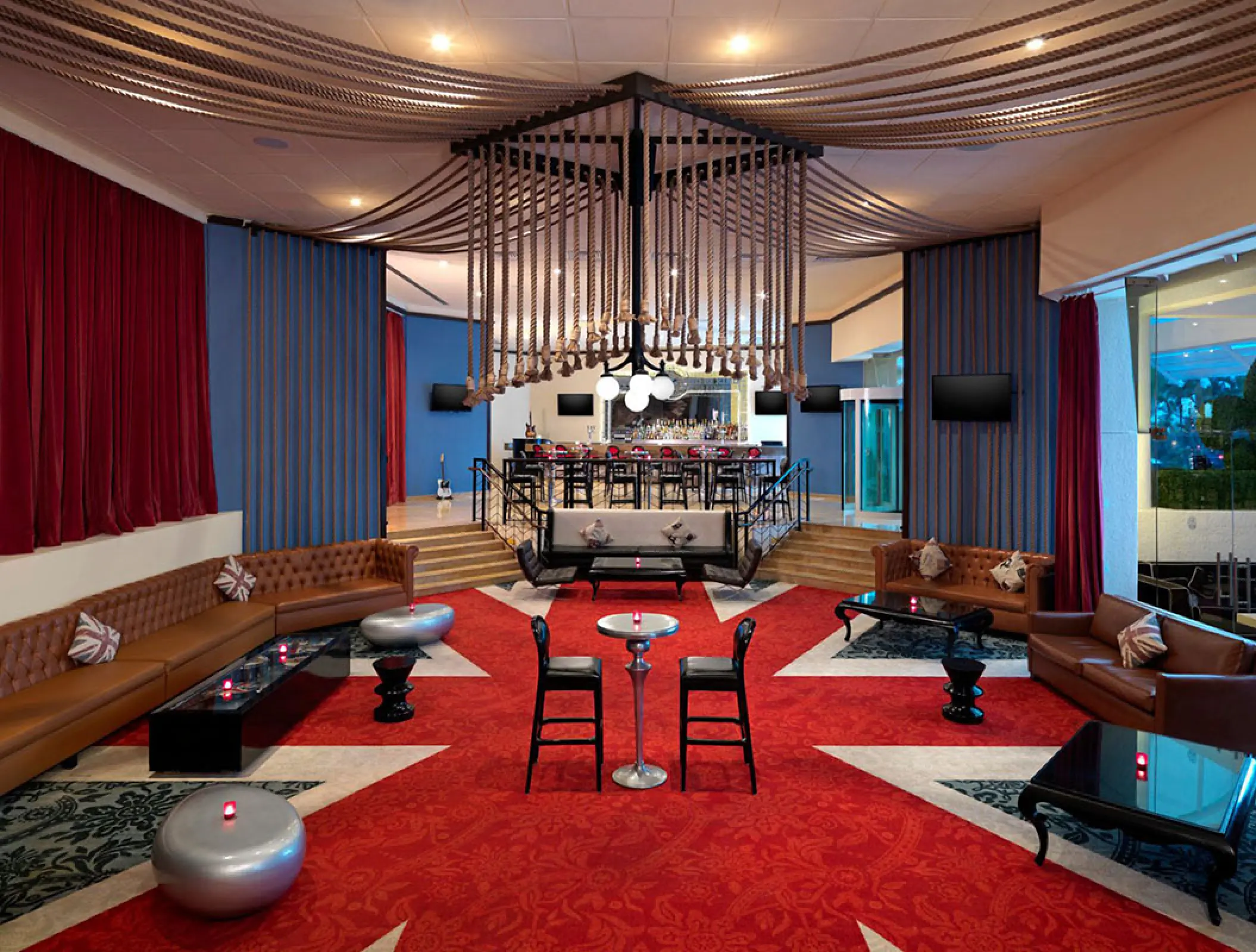 Sun Bar lounge with red carpet and unique ceiling installation at Hard Rock Hotel Vallarta, Puerto Vallarta