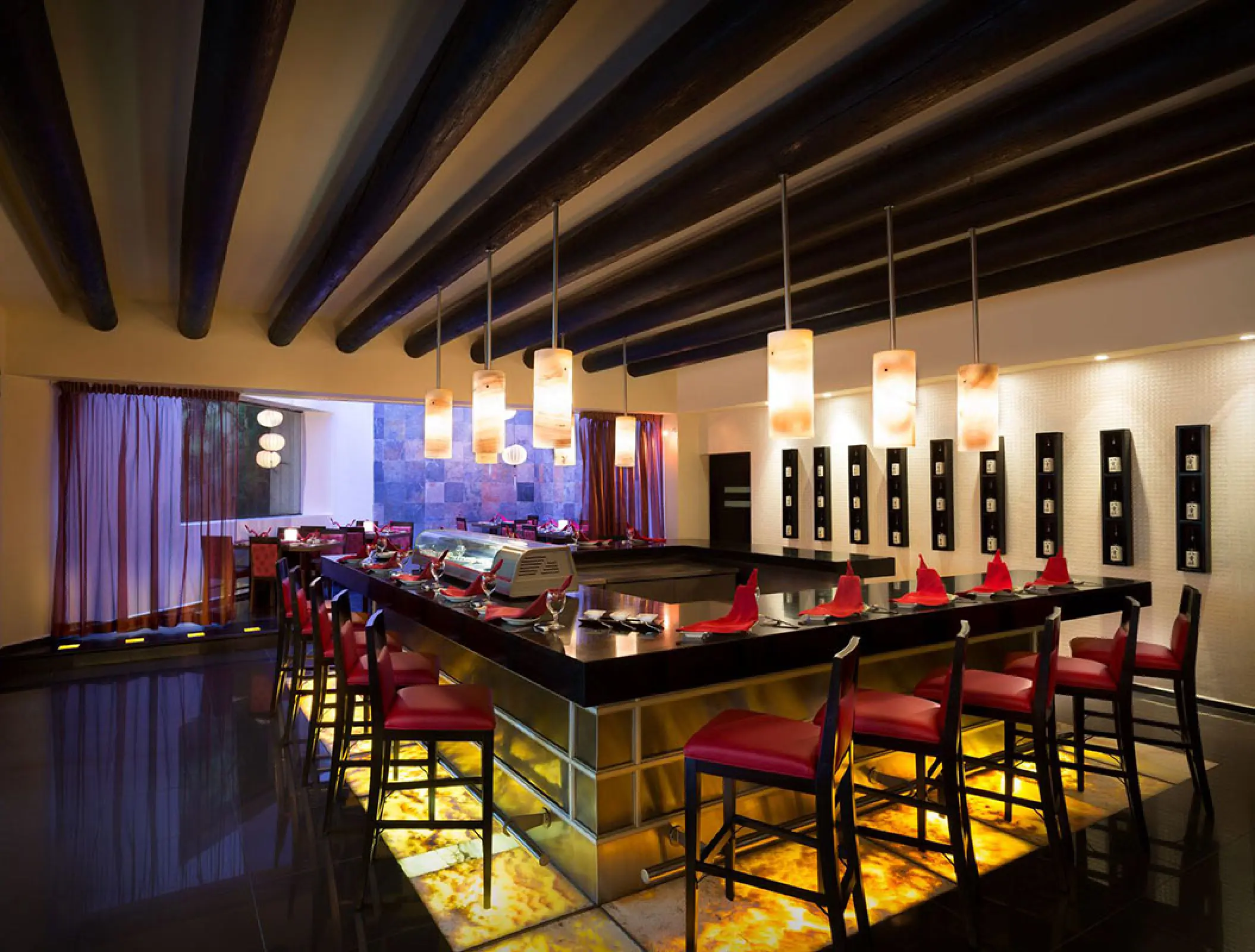 Zen restaurant interior with sushi bar and red seating at Hard Rock Hotel Vallarta, Puerto Vallarta