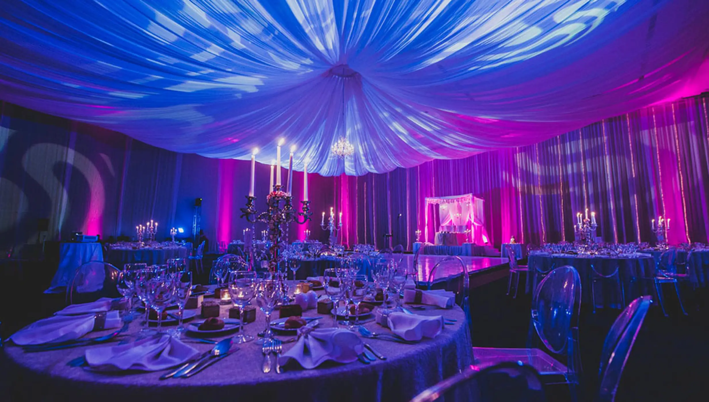 Indoor Indian wedding reception with purple lighting and draped ceiling at Hard Rock Hotel Vallarta, Puerto Vallarta