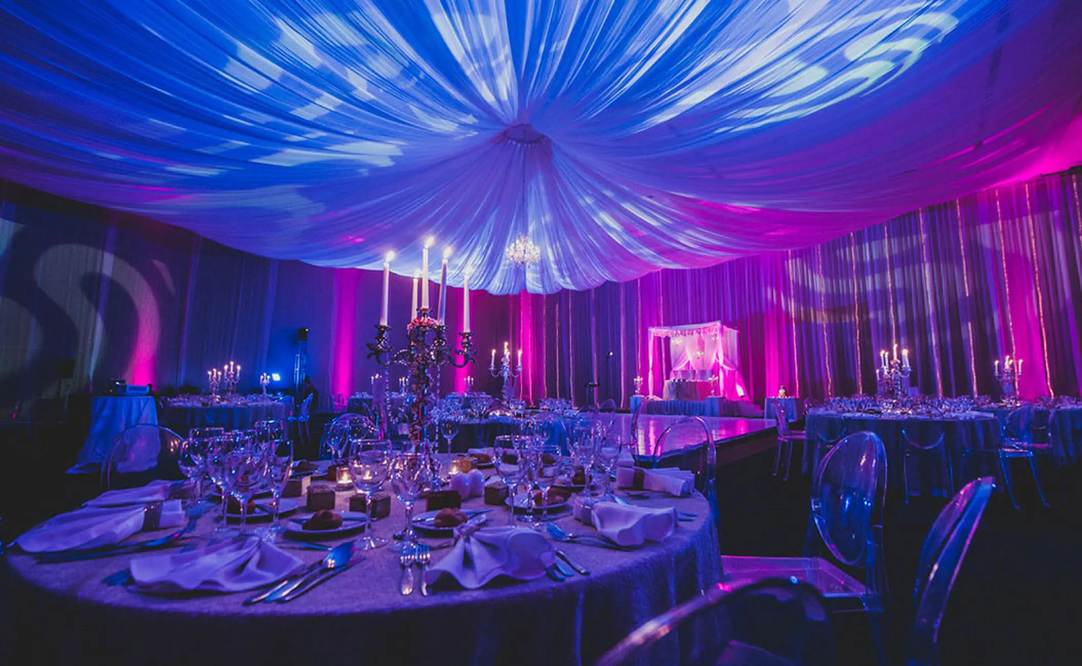 Indoor Indian wedding reception with purple lighting and draped ceiling at Hard Rock Hotel Vallarta, Puerto Vallarta
