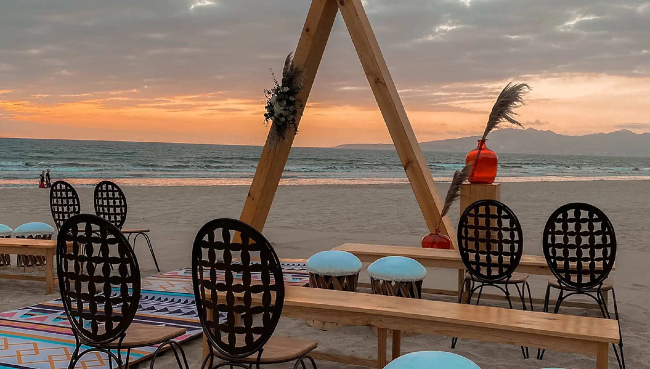 Triangular wooden arch for a beach ceremony at Hard Rock Vallarta, Puerto Vallarta