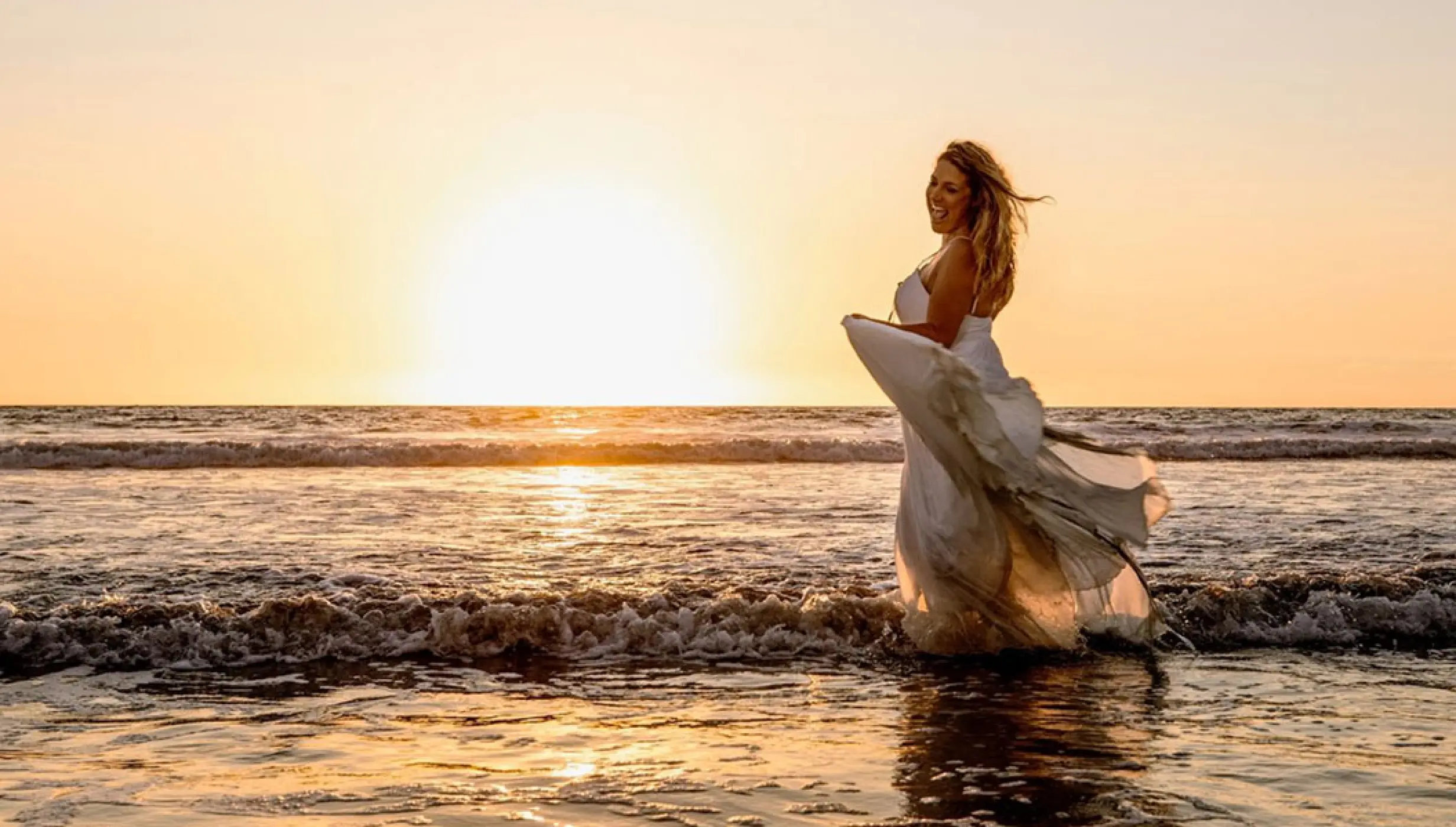 Bride at Sunset beach Wedding Venue at Hard Rock Hotel Vallarta.