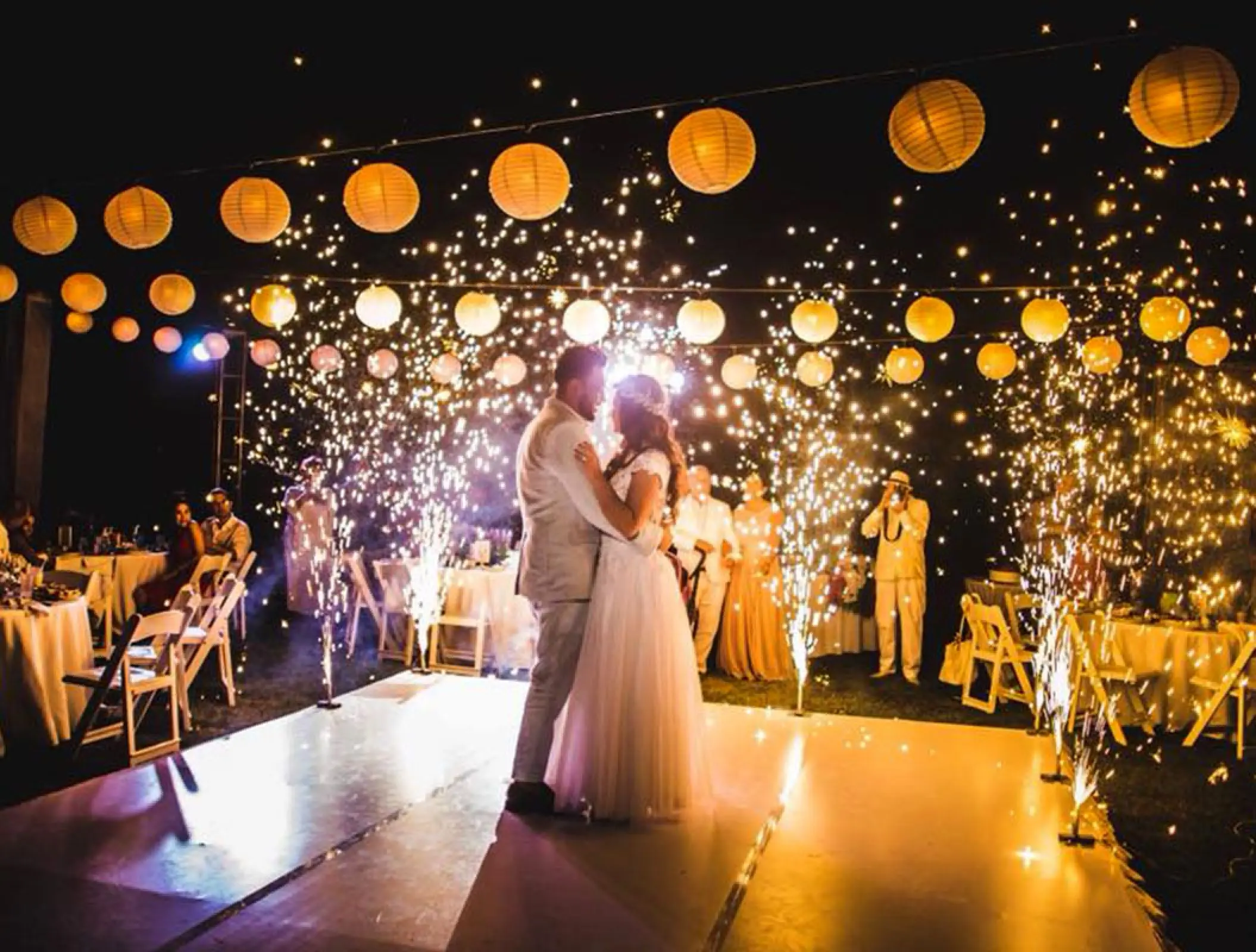Couple dancing at an outdoor wedding reception with cold sparklers at Hard Rock Vallarta, Puerto Vallarta