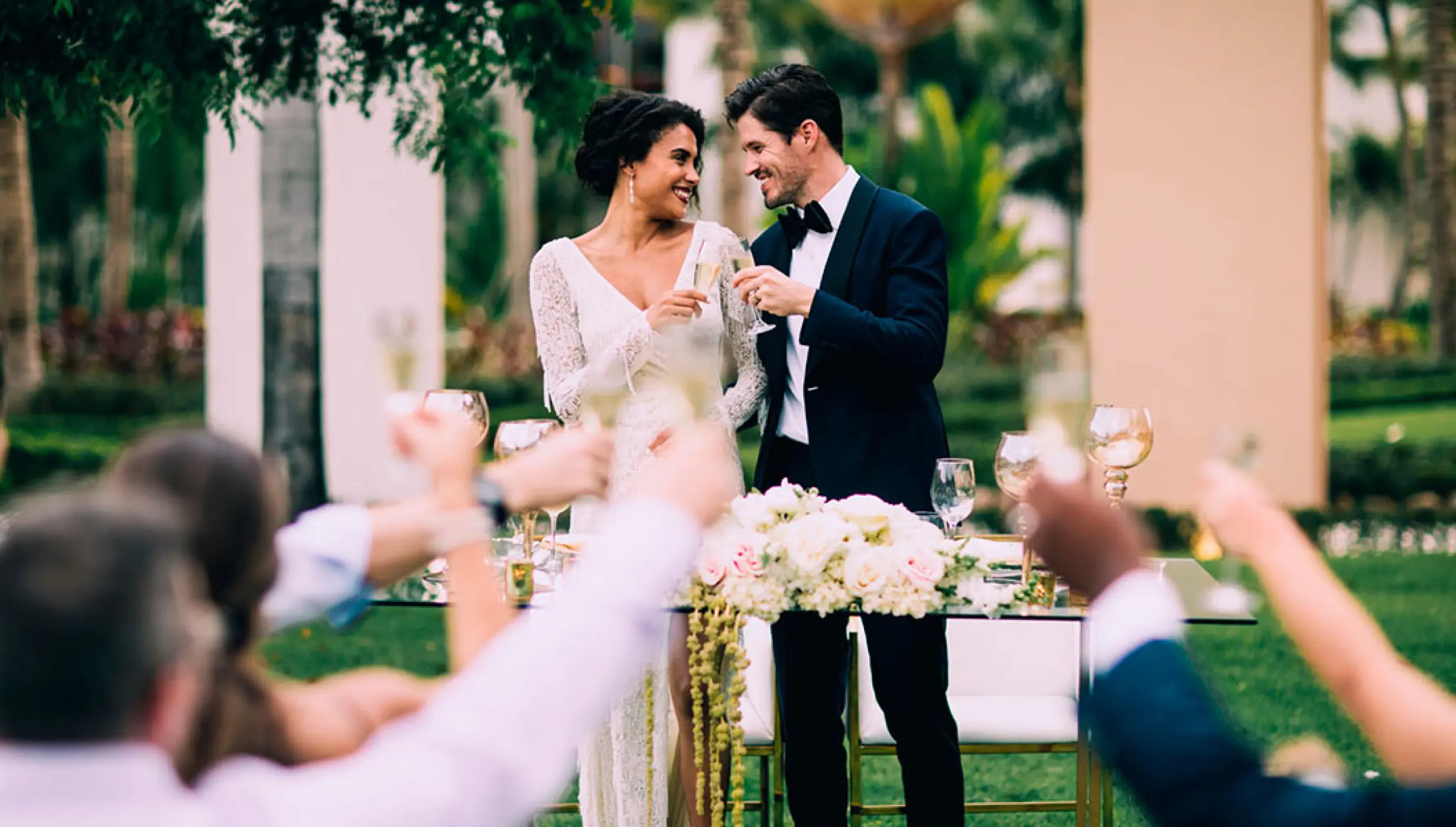 The couple toasting guests at a wedding reception at Hard Rock Hotel Vallarta, Puerto Vallarta