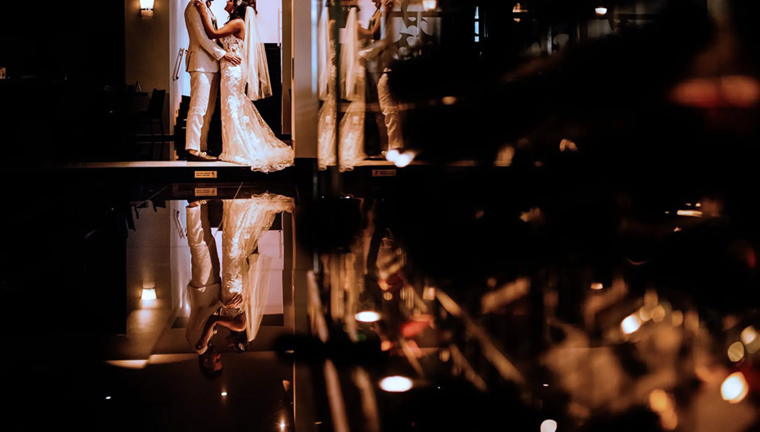 The couple posing for a wedding portrait with reflections at Hard Rock Vallarta, Puerto Vallarta