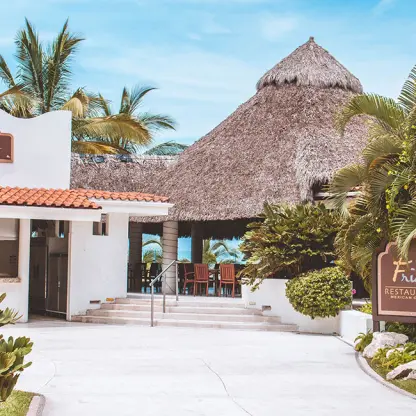 Frida Terrace wedding reception venue with thatched palapa roof at Hard Rock Vallarta, Puerto Vallarta