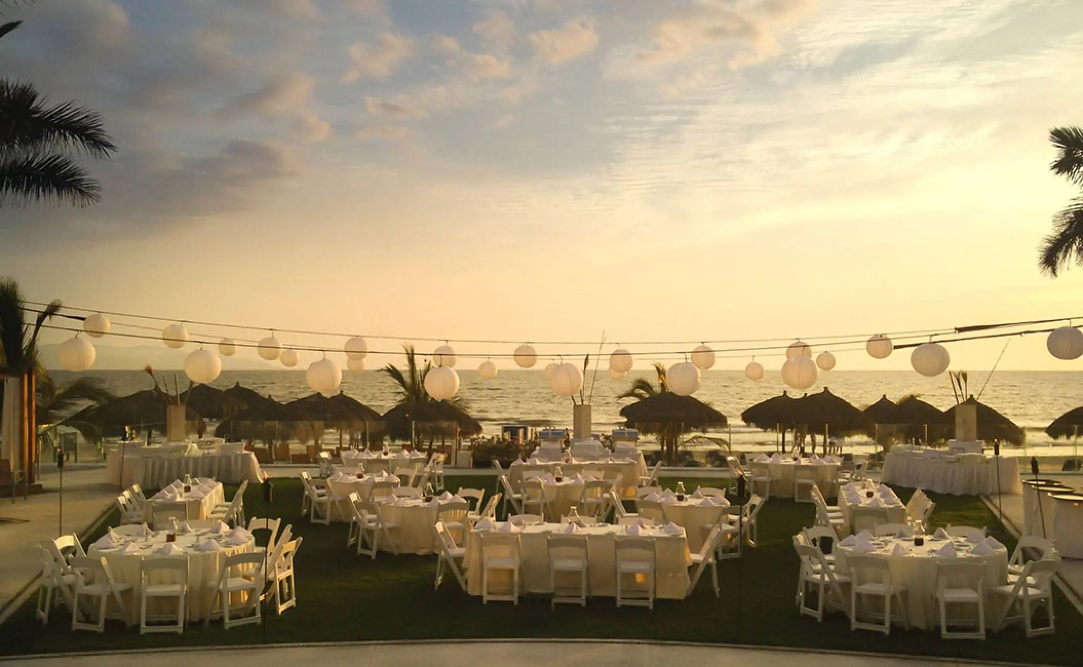 Palm Terrace wedding reception with lantern strings at Hard Rock Vallarta, Puerto Vallarta