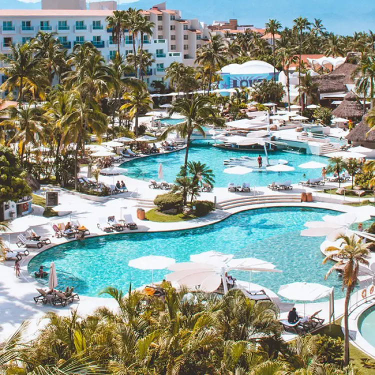 Aerial view of swimming pools and palm trees at Hard Rock Vallarta, Puerto Vallarta