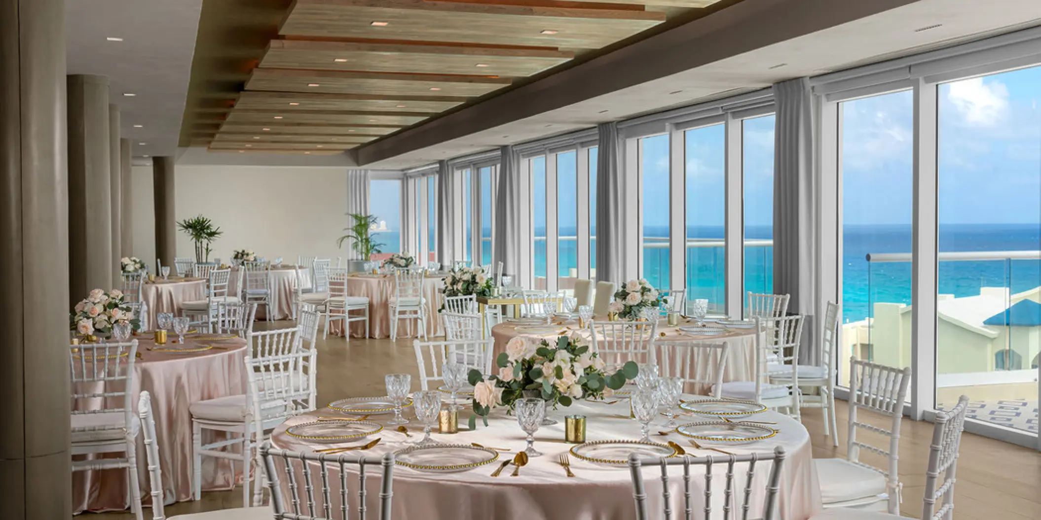 Ballroom wedding reception setup with ocean views at Hilton Cancun Mar Caribe